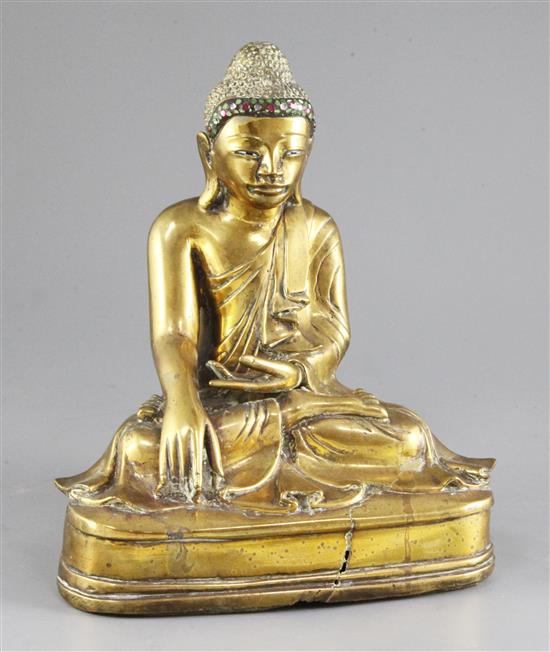 A Burmese bronze seated figure of Buddha, 19th / 20th century, 25.5cm, casting faults